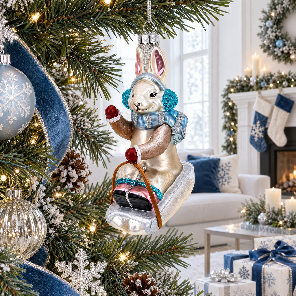 Bunny Sledding with Earmuffs Glass Christmas Ornament